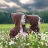 Kinderstrickjacke mit Kapuze und Quaste